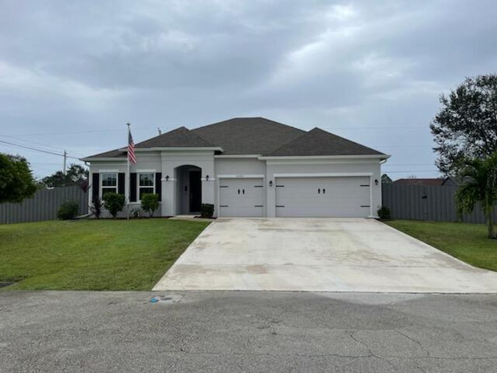 Photo of 4601 SW Alpha Street, Port Saint Lucie, FL 34953 (MLS # R10949057)