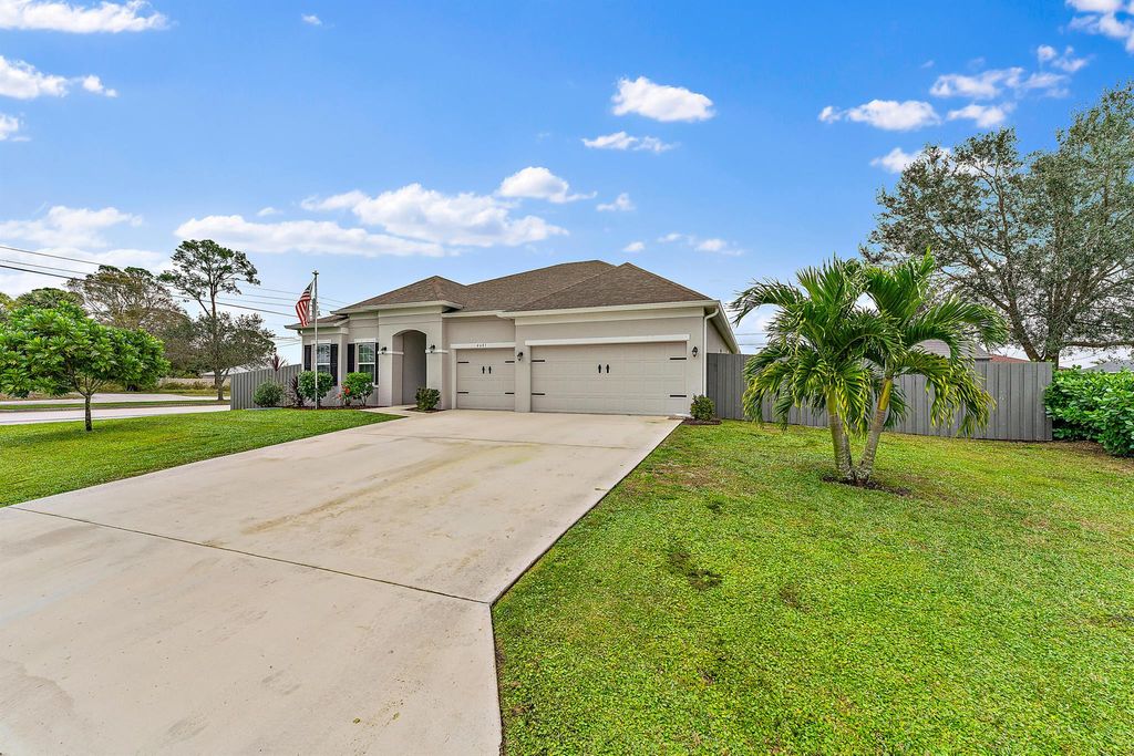 Photo of 4601 SW Alpha Street, Port Saint Lucie, FL 34953 (MLS # R10949057)