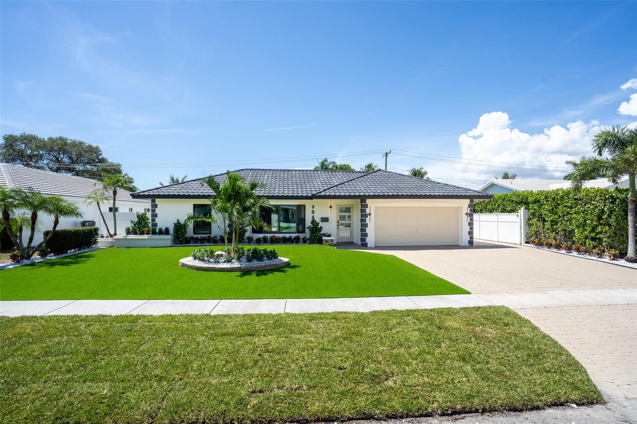 Your tastefully newly remodeled, open concept, beachy modern, pool home awaits you. This home is in a prime east Boca Raton location within walking distance to the A+ rated Addison Mizner Elementary School. The home's serene interior has light oak luxury vinyl plank floors that can withstand all pets and high traffic. The spacious primary bedroom has a stunning ensuite with dual sinks. A large cabana bathroom was tastefully updated to service the spacious 3 bedrooms in this split floor plan home. The oasis style fenced backyard boasts turf grass with a putting green, resurfaced pool, and beautiful decking. The home also has all impact windows and doors which enhances the beautiful South Florida natural light. This beautiful piece of South Florida living awaits you!