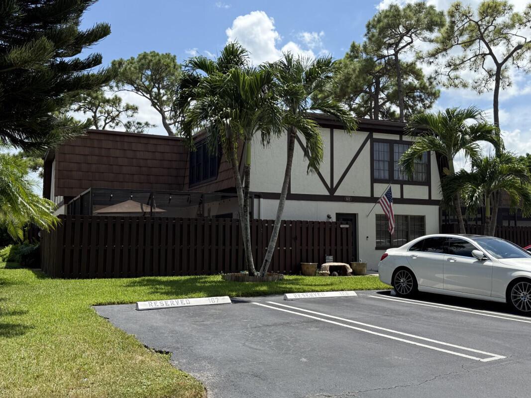 Large Townhome fresh Paint and Carpet IMPACT WINDOWS AND DOORS coming in Sept/ Oct. Large private fenced in patio. Small quaint community nestled in Royal Palm Beach. Perfect private oasis. Community Pool and close to shopping and restaurants.