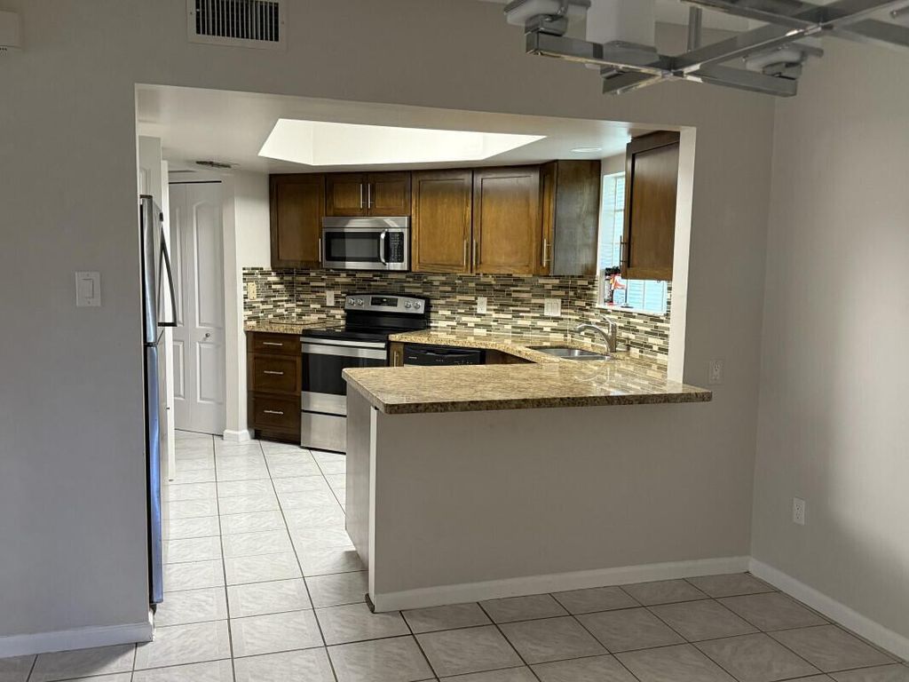 Photo of 122 Weybridge Circle #C, Royal Palm Beach, FL 33411 (MLS # R11117168)