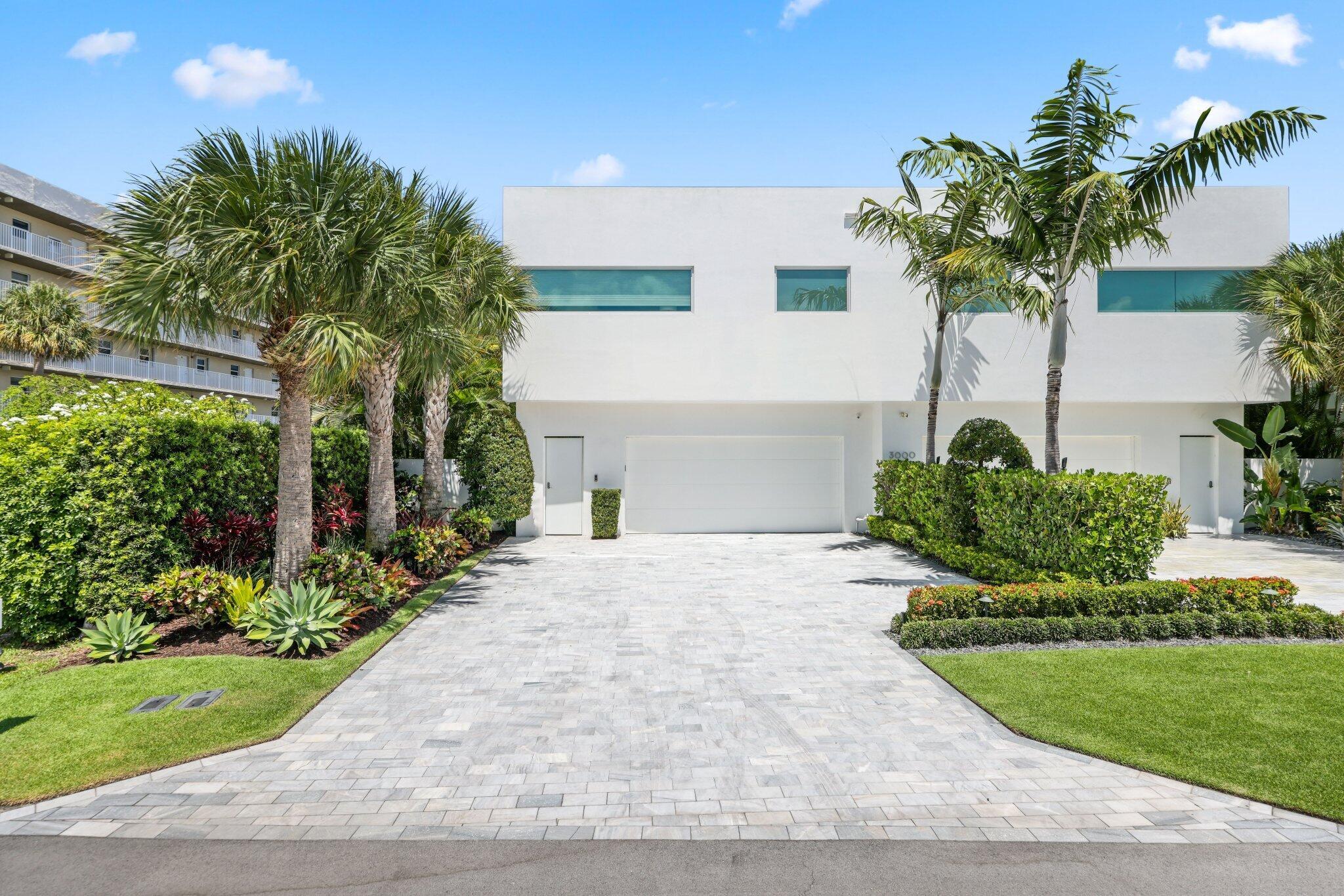 Absolutely stunning and impeccably maintained modern beachside home. This furnished townhome is perfectly situated just one block from Boca Raton's pristine beach and moments from restaurants and shops of Deerfield Beach. Designed with an open floor plan and dramatic floor-to-ceiling windows, this residence is filled with natural light and offers serene views of the private pool, loggia, and lush tropical landscaping. From the moment you enter the impressive foyer, you are welcomed into your own slice of paradise. The gourmet kitchen features Sub-Zero appliances, a natural gas cooktop, custom floor-to-ceiling soft-close cabinetry, and an oversized walk-in pantry. Each of the three spacious bedrooms are en suite, while the primary suite and spa-like bath showcase captivating ocean views.