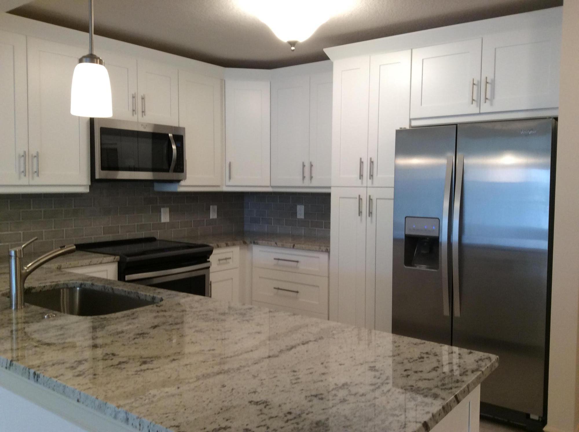 Total floor to ceiling renovation just completed! Split plan offers two master bedroom suites, expanded living room, everything is all brand new!! Tinted IMPACT windows and doors, impact garage door and motor, a/c unit, all underground plumbing, entire electrical panel, 12 x 24 tile throughout, enlarged and open kitchen with full size pantry, granite with decorative back splash, upgraded Whirlpool SS appliances, stainless under mount sink, disposal, full size LG washer and dryer, raised panel interior doors, 5 1/4 baseboards, 2 1/2 casings, popcorn removed, crown molding throughout, designer boxed drop ceiling at dining w/crown, designer tile mosaics at baths, toilets, granite with under mount sinks, faucets, valves, framed mirrors, cased windows, light fixtures, smoke alarms, water