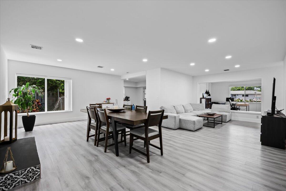 GREAT INVESTMENT OPPORTUNITY! This beautifully renovated home is move in ready and packed with upgrades, including a new roof,whole house water purification system and impact windows for added security and energy efficiency. The home offers a modern open layout with updated finishes throughout. Located just minutes from vibrant Downtown Atlantic Avenue, enjoy easy access to top rated restaurants, shopping, and beautiful beaches. With NO HOA restrictions, this property is perfect for investors, seasonal residents, or full time living. Don't miss out on this exceptional value and unbeatable location!