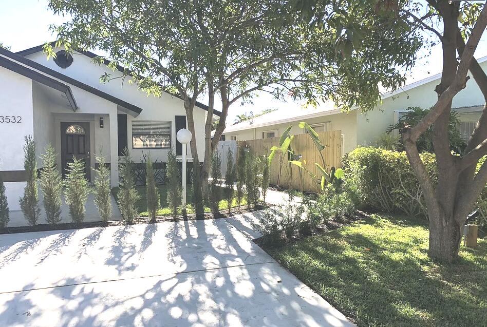 remodeled 1 / 1 with private back yard, lush landscaping mango tree, private gate, water & power included.