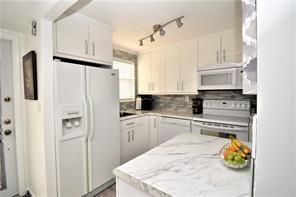 Bright and open 1/1 condo in Phase 3 of Sunrise Lakes community Building #72, 55+ community
Enjoy the convenience of being right across from the clubhouse, plus a second-floor location close to the elevator and laundry facilities. Wood laminate flooring throughout, open concept kitchen with island and hurricane impact windows. Water, Cable, Internet, appliance repair and pest control included. 
Furniture is negotiable or can be removed.
A beautiful and relaxing view of the lake and easy access to everything the community offers.
