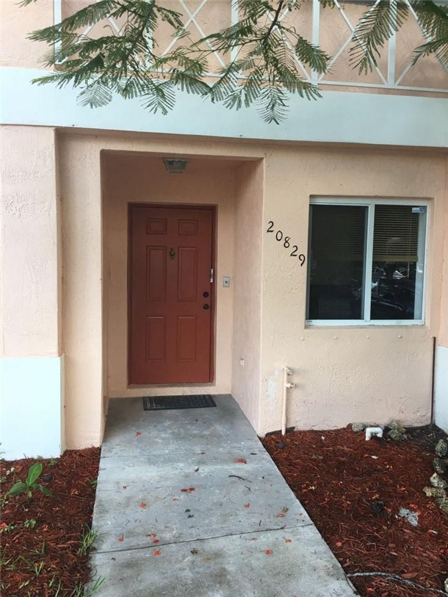 ABSOLUTELY GORGEOUS - Completely remodeled 3/2.5 Townhouse in Malibu Bay. Brand new kitchen with wood cabinets and granite counter tops. Brand new Stainless Steel appliances. Porcelain floors downstairs, laminate wood in the rooms, updated new bathrooms. BRAND NEW A/C unit with 5 year warranty.  Knockdown ceiling, screened patio. Gated community, includes clubhouse, gym, pool, tennis courts and much more. Next to +A Schools. Plenty guest parking. Hurry, this one won't last!!!