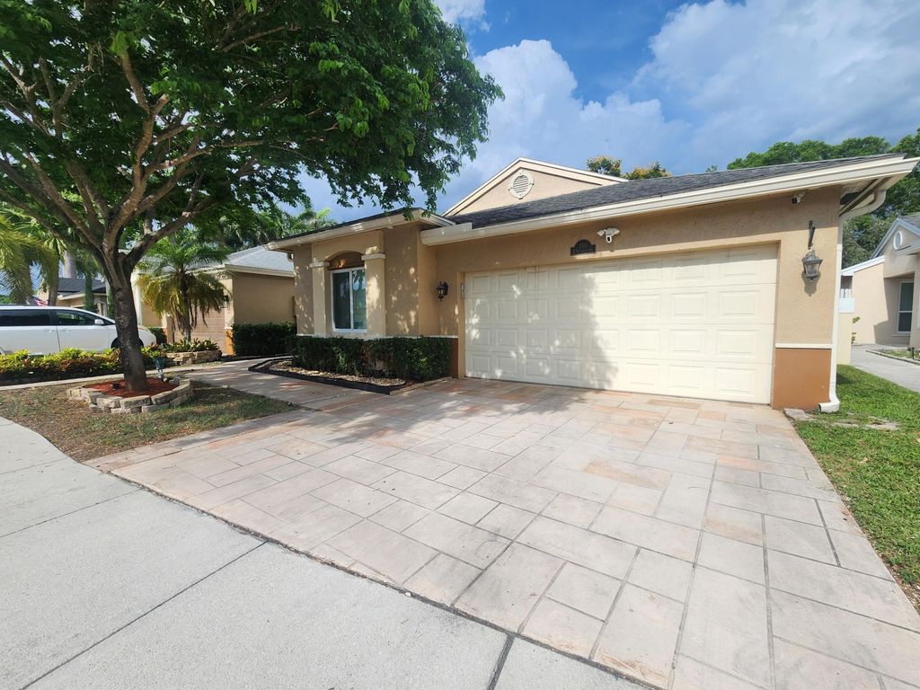 Photo of 250 E Riverbend Drive, Sunrise, FL 33326 (MLS # B26023339)