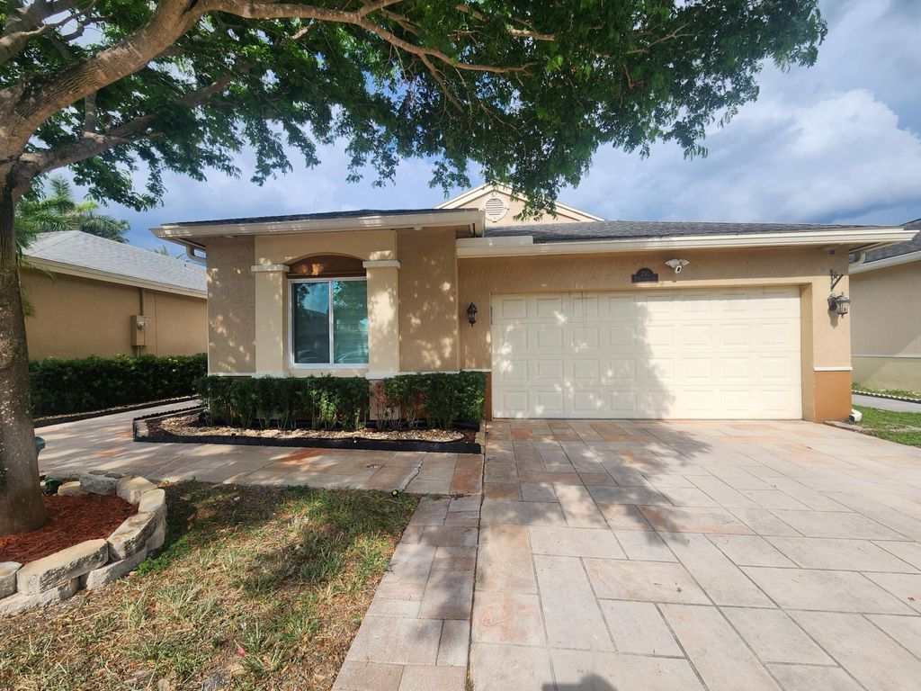 Photo of 250 E Riverbend Drive, Sunrise, FL 33326 (MLS # B26023339)