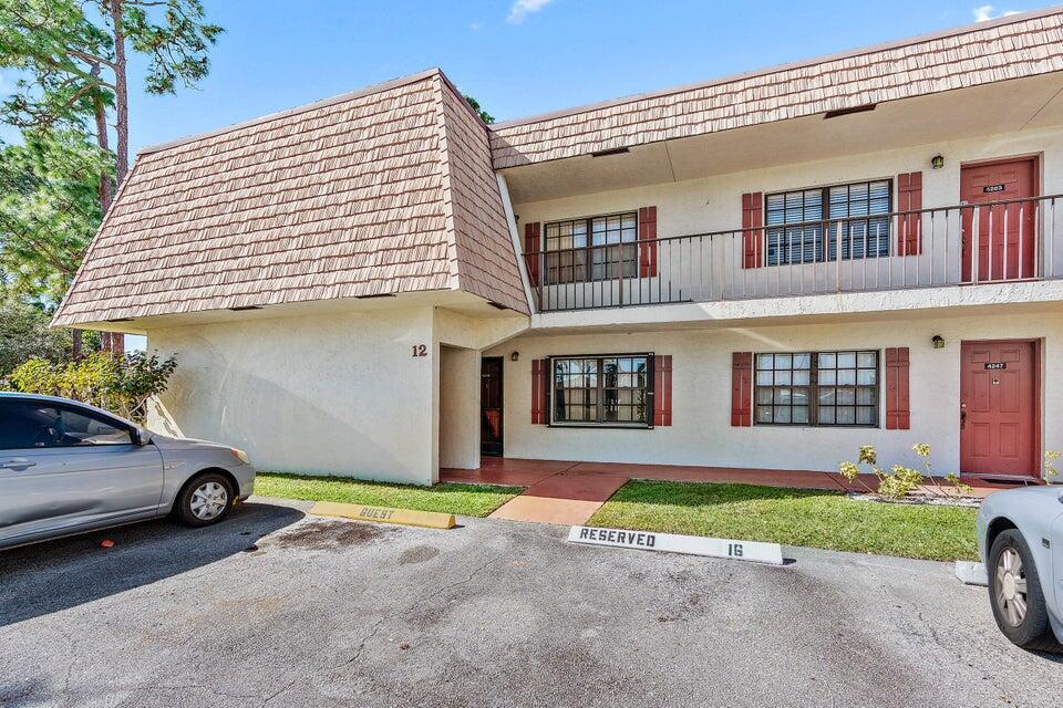 Great 2 bedroom, 2 bath unit in the heart of Greenacres in the quiet and quaint Oak Terrace/Cypress Court community! This unit offers an upgraded kitchen and baths, tile and laminate flooring and a washer and dryer on the premises. Second floor unit and assigned parking! Great place to call home! Schedule a showing today!