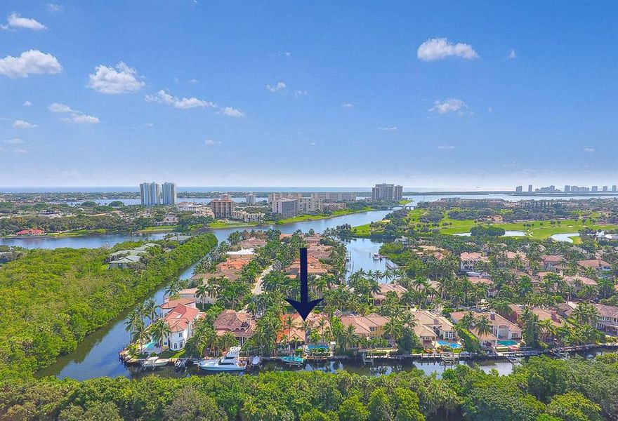 Never before offered custom estate home in the gated community of Harbour Isles. This home offers a very private pool and dock with 90' of deep water frontage and a boat lift. The spacious open floor plan has split bedrooms, honed travertine floors, Pecky Cypress ceilings, authentic Keystone Coral columns, a large office with custom built-ins and a 3 car garage. The Chef's kitchen has custom wood cabinetry, stainless appliances, a gas cook-top with pot fill and a breakfast bar. Amenities include a large covered loggia with a custom Mahogany bar and travertine flooring, a custom pool with European pattern travertine decking and a raised hot tub, outside shower, impact glass, Lite touch automated lighting control system, Ash interior doors and trim and 40KW whole house (See Supplement)