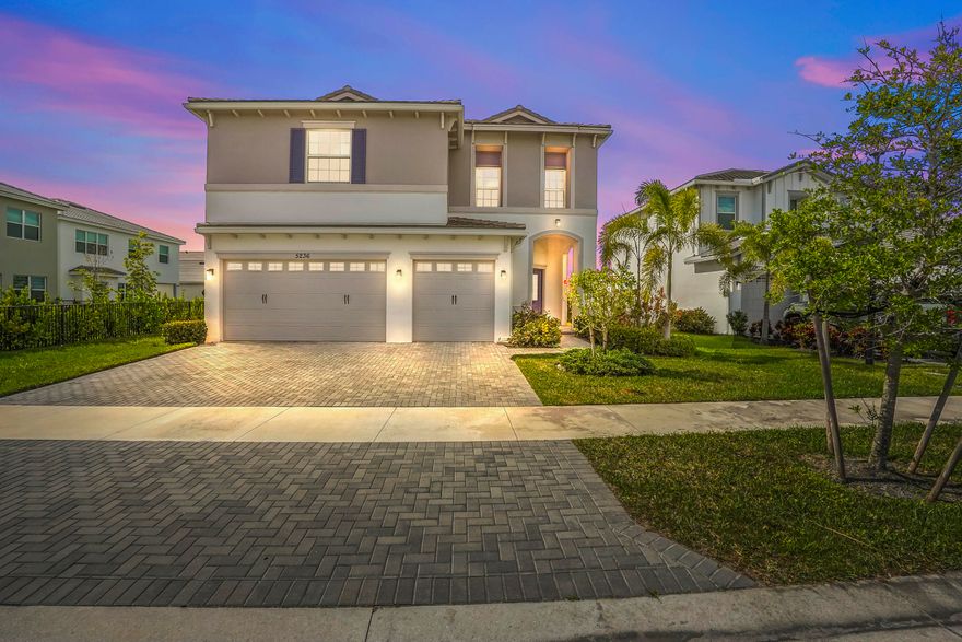 Welcome to this stunning lakefront home in the gated community of Orchards of Westlake! This spacious two-story residence offers 3,330 sq ft of living space with 5 bedrooms and 4 bathrooms, perfectly designed for comfort and functionality.  Step inside through the elegant double-door entry and be greeted by soaring high ceilings and an open, inviting layout. The kitchen is a true centerpiece, featuring a large island, granite countertops with bar seating, 42-inch cabinets for ample storage, and a full set of appliances ideal for both everyday living and entertaining.   The first floor features tile flooring and includes a convenient bedroom and full bathroom, perfect for guests or multi-generational living. Upstairs, you'll find carpeted flooring throughout, a spacious loft area, and a dedicated laundry room for added convenience. The primary suite is a private retreat, complete with double-door entry, dual sinks, and two walk-in closets.  Enjoy Florida living at its finest with a screened and covered patio overlooking serene lake views, perfect for relaxing or entertaining. Additional highlights include a 3-car attached garage and an extended driveway providing plenty of parking space.  Don't miss the opportunity to own this beautiful lakefront home in one of Westlake's desirable gated communities!