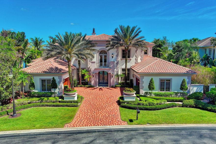 Experience the pinnacle of luxury living at 109 Playa Rienta, located in the prestigious Country Club at Mirasol in Palm Beach Gardens, Florida. This stunning estate home offers unparalleled elegance and quality, boasting picturesque views overlooking a large, serene lake nestled within the lush greenery of the golf course community.As you step through the grand double glass doors, you'll be greeted by exquisite architectural details that define this home's unique charm. The expansive living space spans 8000 square feet, featuring five spacious suites, including a lavish master bedroom with his and her baths. The office is a masterpiece, with beautifully paneled walls and a cozy fireplace, creating an ideal space for working from home.GOLF MEMBERSHIP