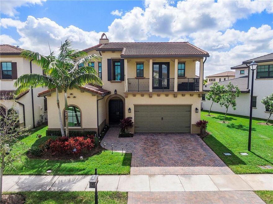 This beautiful Provence model is located on a prime water lot with wide water views in Watercrest, one of Parkland's most sought after gated communities! Features include a foyer entrance, formal dining  /office, casual dining, great room, a downstairs master suite and a spacious loft!  The kitchen offers stainless steel appliances, granite counters, center island, pantry, wood cabinets and a glass tile backsplash! Entertain under the covered patio with retractable screen, built-in grill and hot tub. Swim in your own backyard paradise in the tropical salt water pool with a sun shelf and travertine decking while watching the sunrises and sunsets! This community offers amazing amenities, low HOA fees and great area schools! This is truly South Florida Living at its best!!!