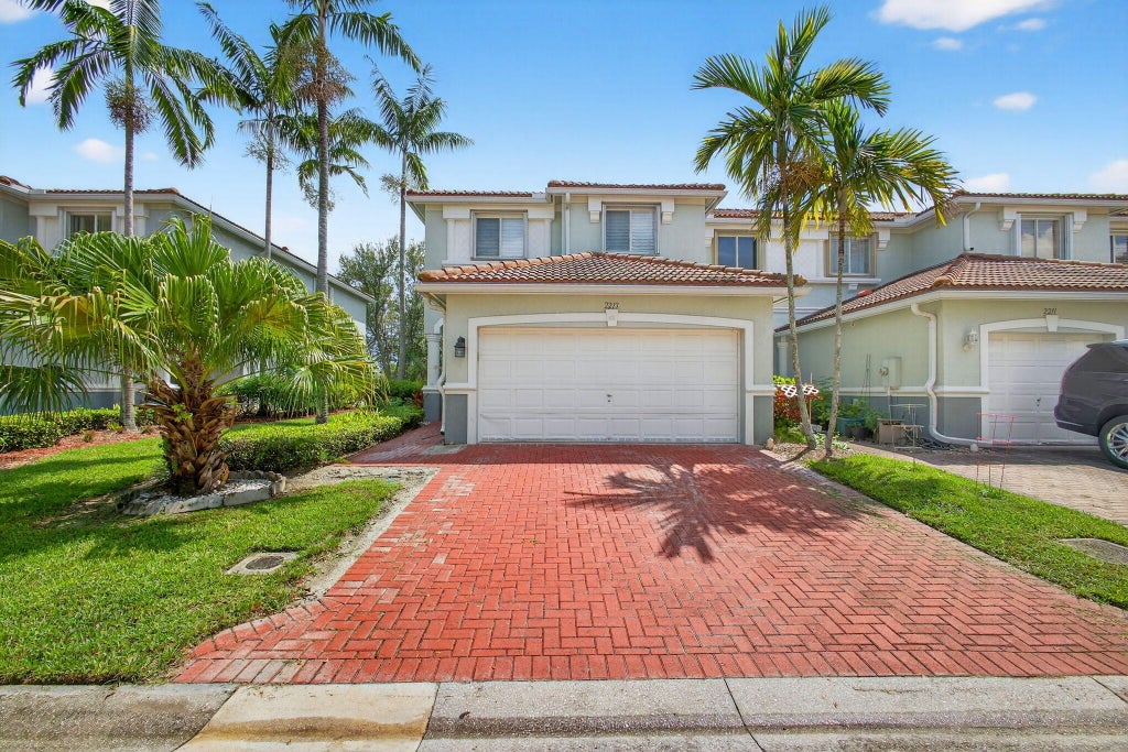 Photo of 2213 Oakmont Drive, Riviera Beach, FL 33404 (MLS # R11121114)