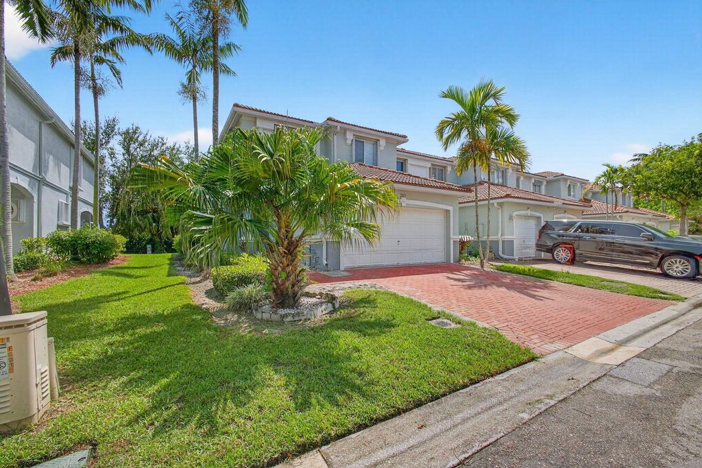 Photo of 2213 Oakmont Drive, Riviera Beach, FL 33404 (MLS # R11121114)