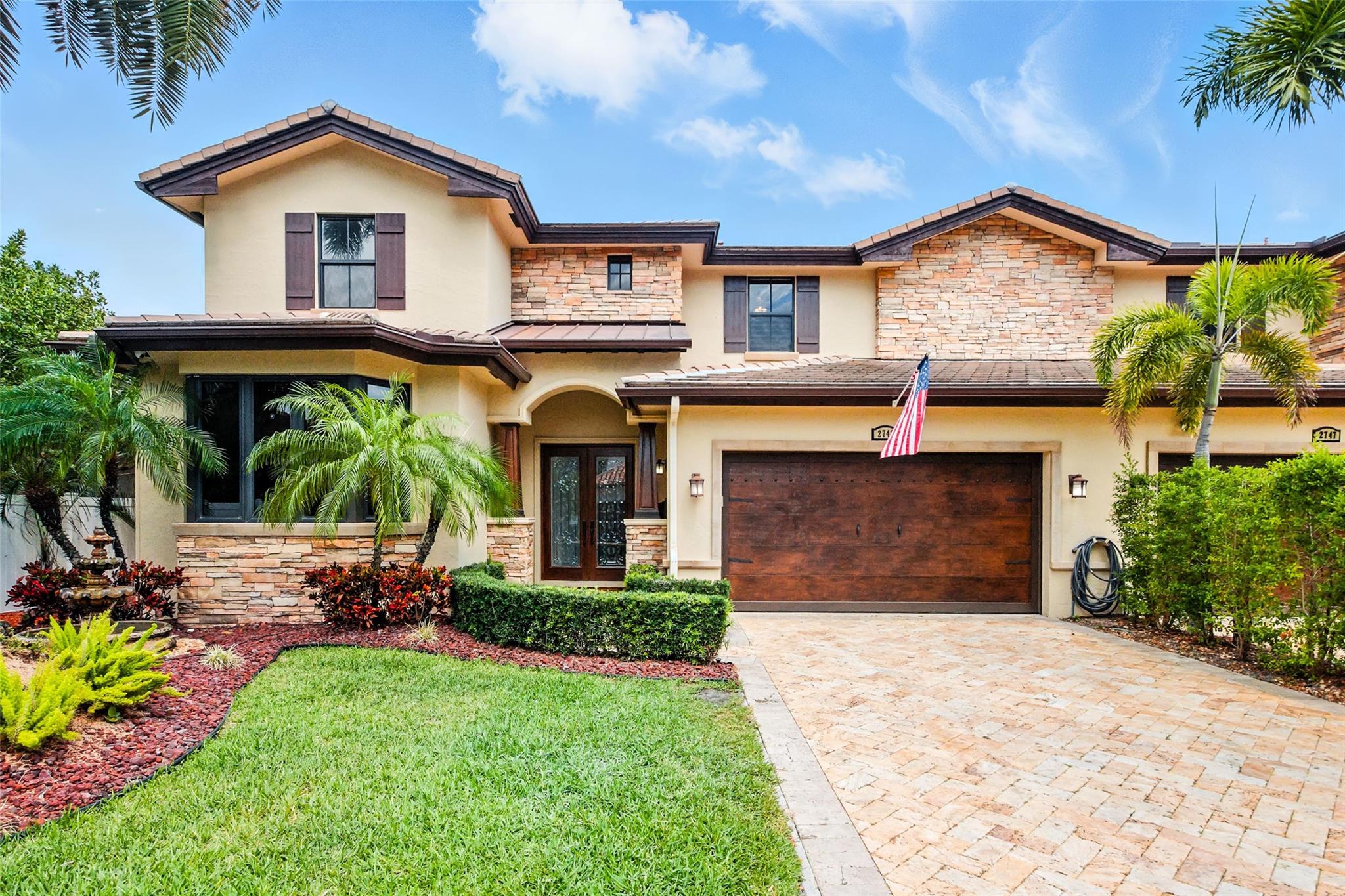 Spacious 5 bedroom townhome in the heart of Coral Ridge. Located on a quiet, tree-lined street and zoned for A-rated Bayview Elementary. The private backyard features a sparkling heated, salt water pool, ideal for relaxing & entertaining while offering the feel of a single-family home. 1st floor highlights include an open kitchen with black granite counters, gas range & double oven. Tumbled marble floors in living area, family room with breakfast nook, formal living & dining spaces & bedroom and/or home office. Upstairs a large primary suite with 2 WIC & balcony overlooking the backyard. Bonus room & 3 additional spacious bedrooms. Hurricane impact windows/doors, 2 zone AC (2022 & 2025), buried propane tank & ADT security system. Gas hookup already in backyard for future outdoor kitchen.
