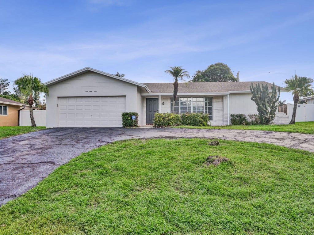 Photo of 4850 NW 5TH Terrace, Boca Raton, FL 33431 (MLS # B26085477)