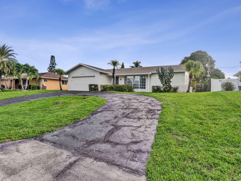 Photo of 4850 NW 5TH Terrace, Boca Raton, FL 33431 (MLS # B26085477)