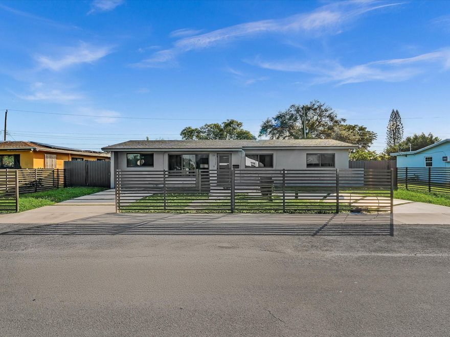 Peaceful paradise in the beautiful city of Miami Gardens. This home features 4 bedrooms and 2 bathrooms. Home was recently remodeled with a host of upgrades. The home comes equipped with a new roof, high impact windows, and a new custom driveway. Centrally located in the heart of Miami Gardens, surrounded by A schools, and all major transportation vessels. 10 minutes away from HardRock stadium, F1 racing, and the Miami Open. This home is a MUST SEE and won't last.