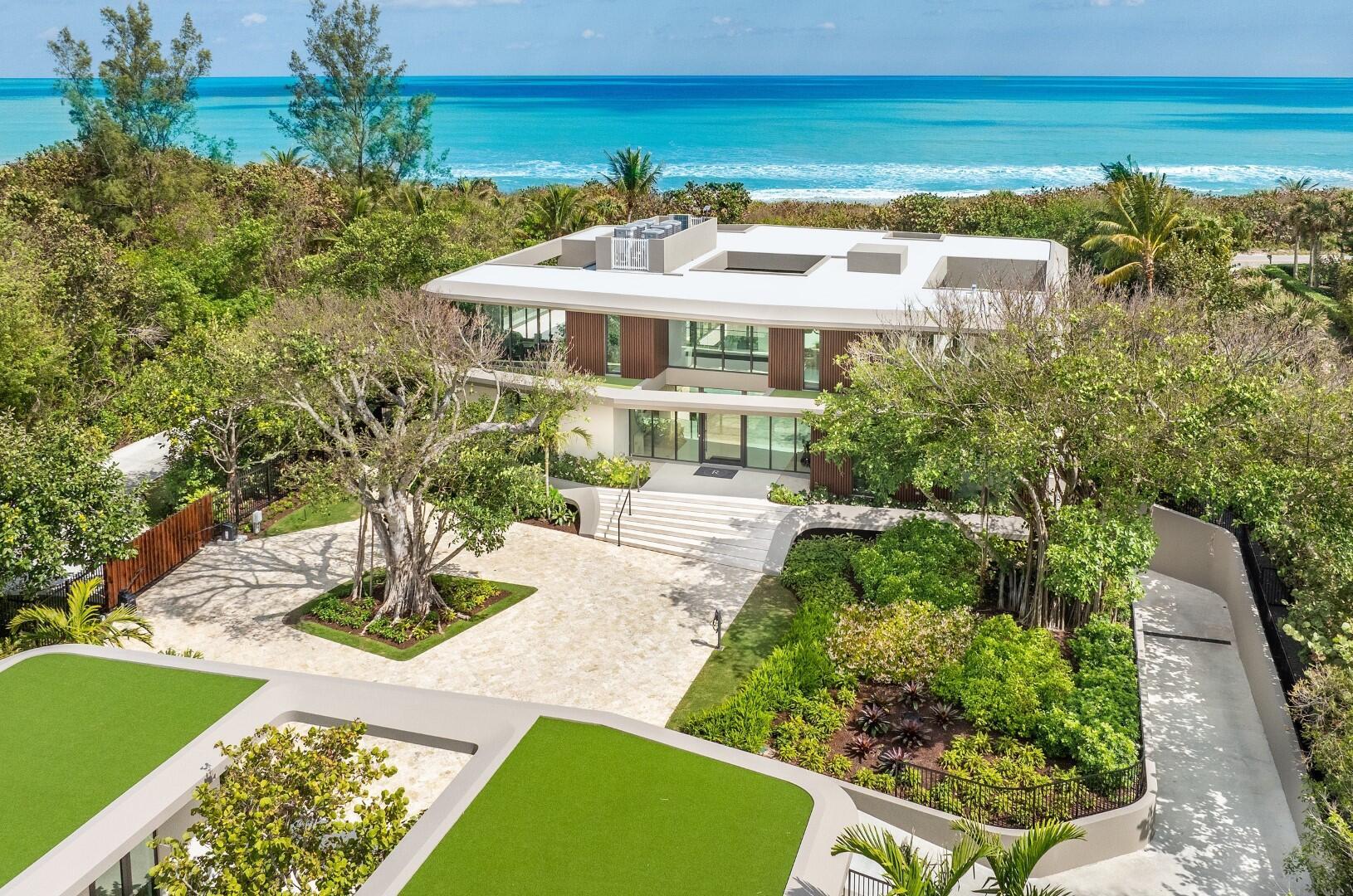A One-Of-A-Kind and unseen oceanfront estate on Jupiter Island. Designed by internationally renowned architecture firm DOMO Architecture + Design, this breathtaking home four years in the making was inspired by the natural beauty of the blowing rocks of Jupiter Island with organically shaped modern design that reflects the surrounding natural environment. Situated on a sprawling 3.5 +/- acre east and west parcel lot with approximately 179 feet of direct ocean frontage. Painstaking details with 18,500+/- total square feet, the home features 6 bedrooms, 8 bathrooms, and 1 powder room, soaring 11' ceilings on the main floor, and grand double height 24' foyer. Gourmet chef's kitchen with Subzero appliances and oversized eat-in exhibition kitchen with double islands and breakfast area.