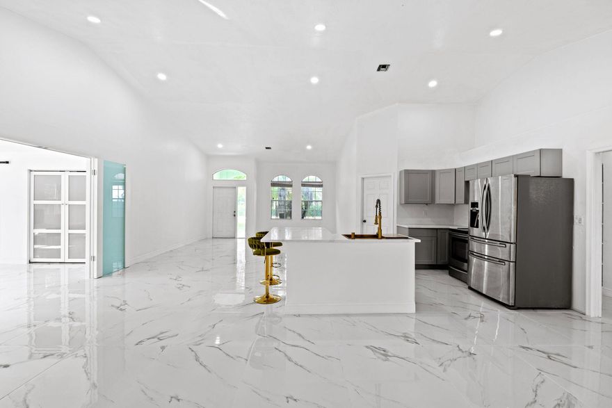 Experience the ultimate freedom of Loxahatchee living on this sprawling 1.15-acre estate. This 3BR/2BA pool home features a split floor plan and a massive screened enclosure with an integrated pool and hot tub. Beyond the main residence and its glass-enclosed patio, discover the property's true "X-factor": a substantial secondary structure ready for your vision. Unlock massive equity! Whether you dream of a car and toy garage, a mother-in-law suite, or functional stables, the footprint is here for your creative control. Located in a prime, NO-HOA sector of The Acreage, you are minutes from Wellington's world-class equestrian venues. Enjoy a horse-friendly sanctuary, zero restrictions for your RV and toys. Minutes from town. Value is in the land, location, and endless upside. Sold As-Is. **Available/Showings may begin at/after Open House 4/26** No Exceptions please.