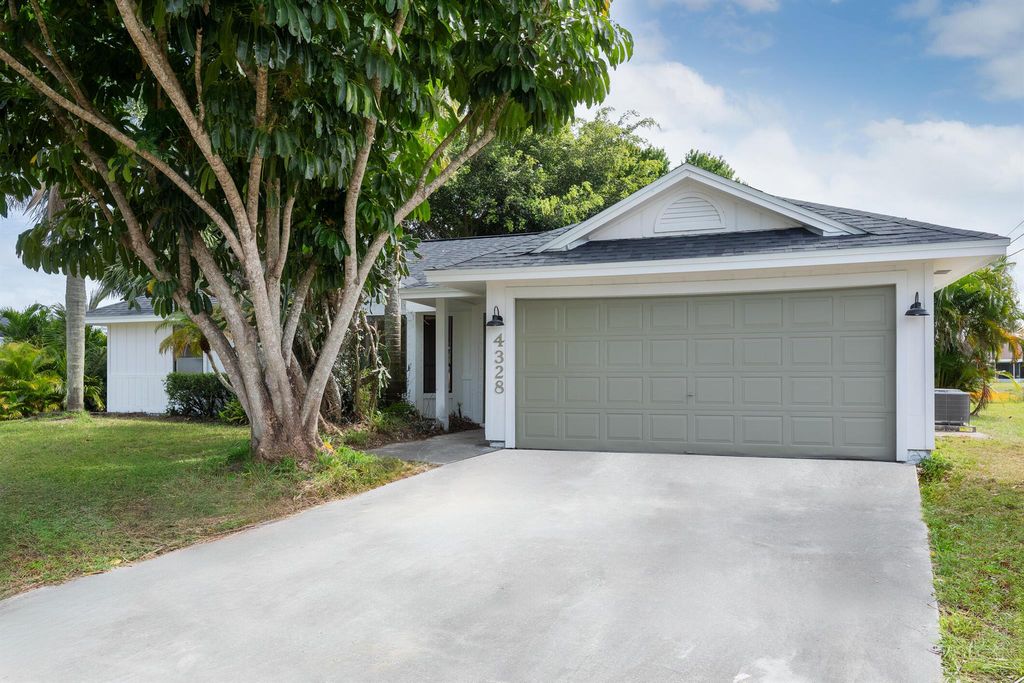 Photo of 4328 SW Jarmer Road, Port Saint Lucie, FL 34953 (MLS # R10965494)