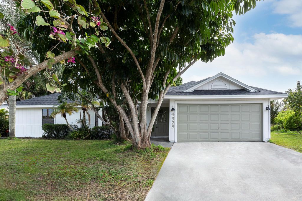 Photo of 4328 SW Jarmer Road, Port Saint Lucie, FL 34953 (MLS # R10965494)