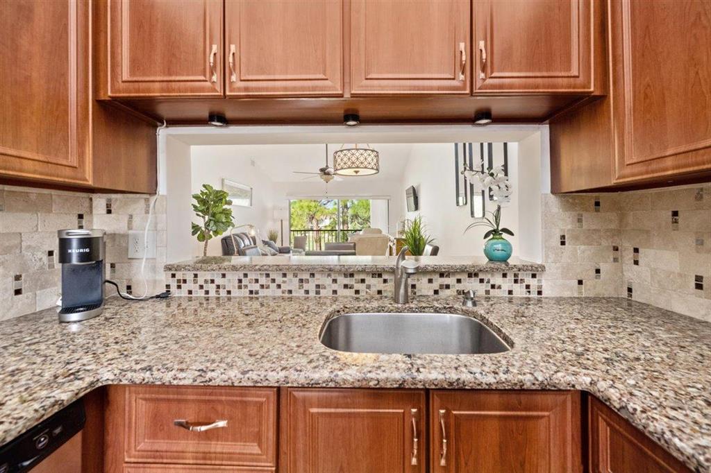 FULLY UPDATED, ALL AGES, CORNER UNIT with Breathtaking views of the Golf Course and no membership required!!Located in the heart of Jupiter within the highly desired Indian Creek community of Pinecrest, this IMPRESSIVE home is Move in Ready and features UPDATES GALORE! This beautiful condo features Vaulted Ceilings, Hurricane Accordion Shutters, Open Concept Kitchen w/ Quartz Countertops, Designer Backsplash, Stainless Steel Appliances, Master Bath Fully Remodeled, New Washer/Dryer, A/C 1 Year Young, New Electrical Panel Installed & Plumbing Updated, Newly Custom Built Closets, Cabinet lighting in kitchen and bathroom, & Extra Storage Space. Located near to Beaches, Restaurants, Shopping and Central to Highways, this home is a MUST SEE and wont last long!