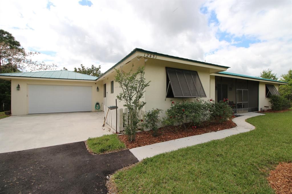 Photo of 12451 Piper Cub Terrace, Port Saint Lucie, FL 34987 (MLS # R10702328)
