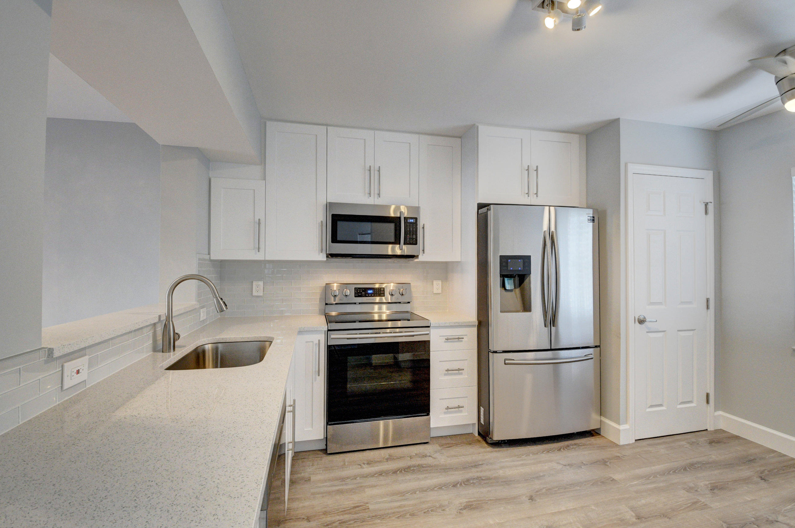 Live the Good Life in this beautifully renovated 2BR/2BA condo in a desirable 55+ gated community just minutes from Downtown Delray and the beach. Enjoy a bright, spacious primary suite with walk-in closet, an open kitchen with abundant storage, full-size washer/dryer, newer appliances, and an enclosed Florida room for extra living space year-round. The community features a newer clubhouse with resort-style pool, hot tub, gym, billiards, poker and card rooms, community room, and a scenic 5-mile walking path. Perfectly located near dining, shopping, theaters, library, houses of worship, medical facilities, and more--schedule your showing today!