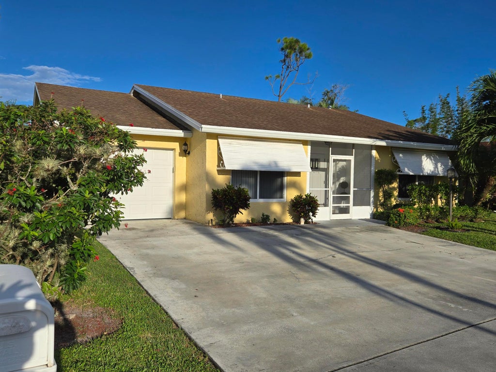 Photo of 7099 PINE MANOR Drive, Lake Worth, FL 33467 (MLS # B26084646)