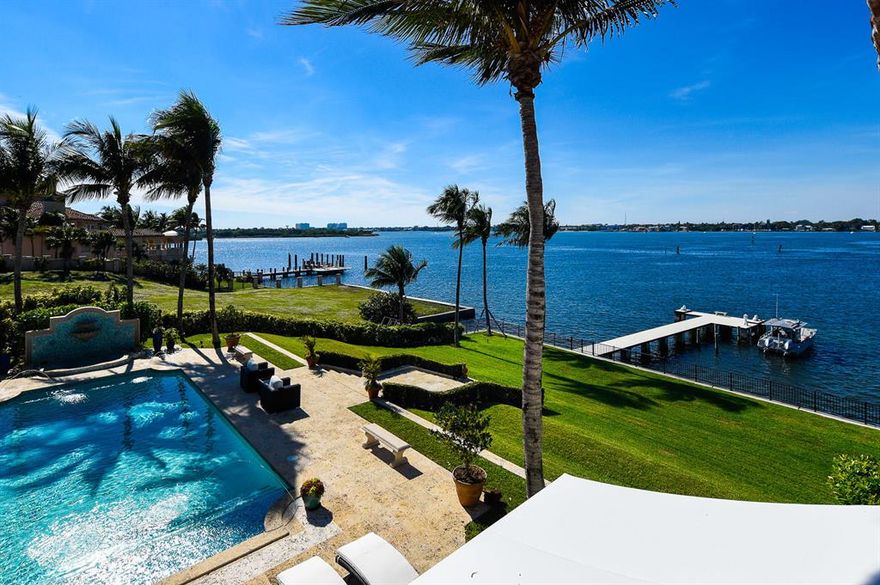 Gorgeous Ocean-to-Lake 8BR/9.1BA estate with commanding water views. Home is perfect for entertaining with formal foyer leading to reception room, dining room, formal living room with fireplace, and oversized family room with marble bar. Covered loggia and terrace with fireplace open to 40 foot swimming pool, summer kitchen, and BBQ, all overlooking the Intracoastal and private dock. Gourmet eat-in kitchen features chef's island and waterfront breakfast room. No detail has been overlooked, with gorgeous finishings, intricate ceilings, wine room, elevator, media room, and beautiful flooring. Winding staircase leads to second floor with four waterfront balconies. Master wing with fireplace, wet bar, dual baths and closets. Four car garage with 2 bedroom guest house. To be sold As Is. All sizes approximate and subject to errors and verification. Sq. Ft. as per county tax rolls.
