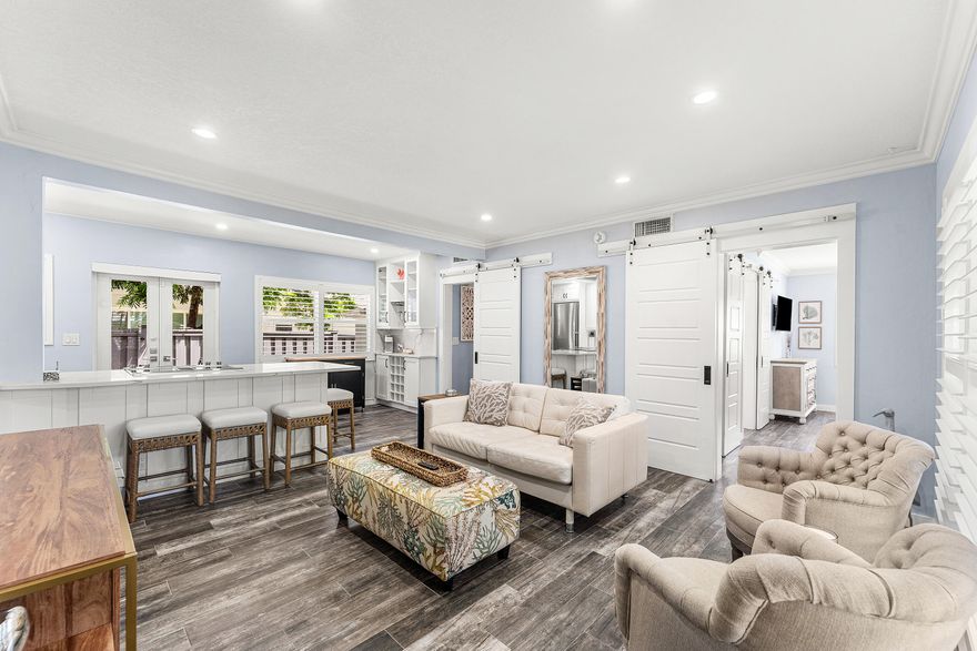 Experience refined coastal living in this impeccably remodeled turnkey residence just one block from the beach. Located in an exclusive boutique building of only six units, this home offers privacy and sophistication. Features include a beautifully updated kitchen and baths, impact glass throughout, plantation shutters, crown molding, and a private fenced patio ideal for outdoor living. A rare opportunity in a highly desirable beachside location.