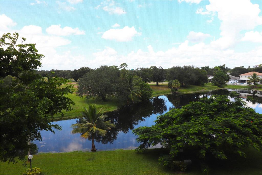 Photo of 3499 Oaks Way #407, Pompano Beach, FL 33069 (MLS # F10400474)