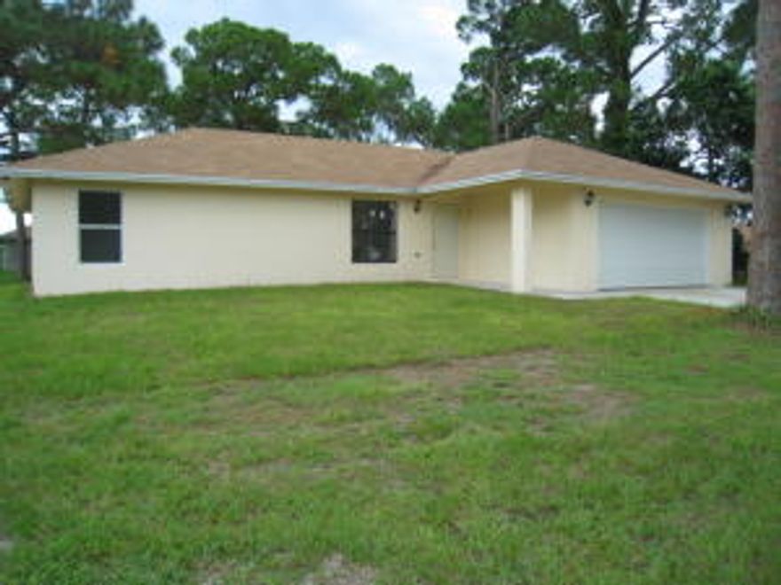 Own this brand new home in the heart of West Palm Beach! It has never lived in. This new construction home sits on an over-sized fully fenced lot. Everything is brand new, plus the seller is giving a 1 year warranty. The living areas have 12 foot ceilings and over-sized ceramic tile throughout. The extra-large master bedroom includes a generous walk-in closet and berber carpet. Other features include a fenced yard, hurricane shutters, high efficiency air conditioning, over-sized 2 car garage, separate laundry room, and possible owner financing (call for details). A new stove will be installed prior to closing. It's rare finding a new construction home in West Palm Beach; don't let this on slip away.