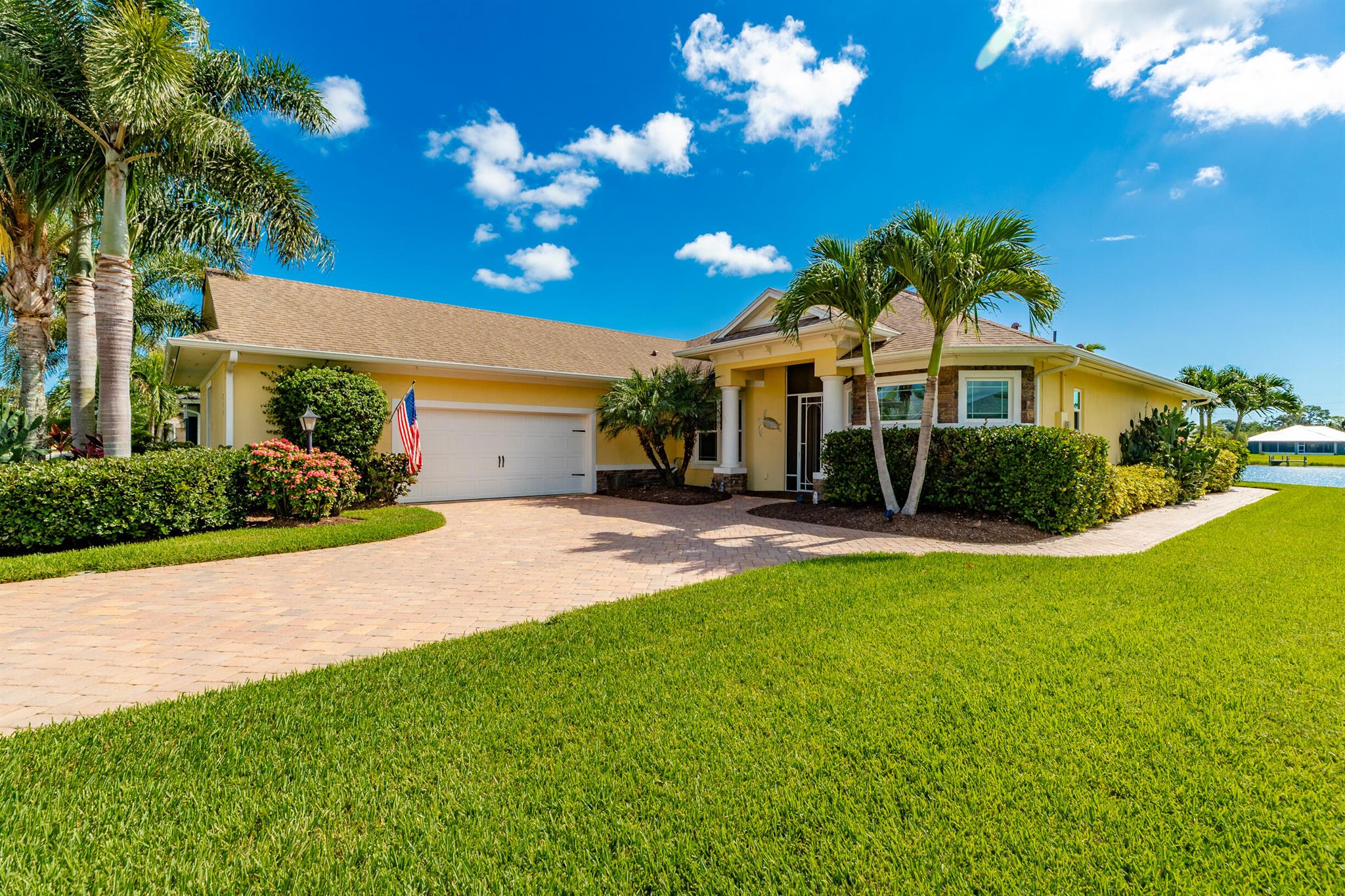 This lightly lived in and impeccably maintained 4-BR/3-Bth/900 sqft 3 car garage LifeStyle Lake home is the definition of ''Pride of Ownership'' and offers the perfect balance of Comfort, Style & Functionality w/generous living spaces & thoughtful design. Every room feels welcoming and bright w/upgrades throughout. Beautiful kitchen & bathrooms w/Quartz countertops, elegant finishes, soft close drawers & custom closets. Lush landscaping, impact windows & doors, full glass front door w/2 glass panels,16K kw Generac Generator w/500-gal. tank, soffit lighting, paver driveway/screened patio & mosquito misting system. Located close to the river & beaches.