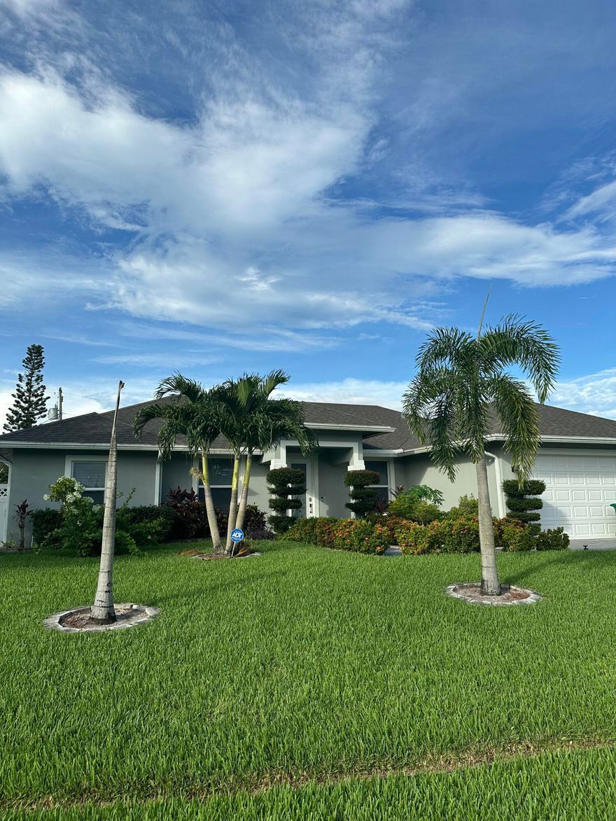 Beautifully upgraded 4BR/3BA in the Becker area, built in 2022 on an oversized lot with no HOA. This move-in ready home offers impact windows, large porcelain tile throughout, and a stunning kitchen with quartz waterfall countertops. Inside you'll find custom-built pantry and closet shelving, plantation shutters on every window with a motorized shade on the slider, and a full-house water purification system plus a separate drinking/cooking filter. The home's electrical panel is generator-ready for peace of mind. Outdoors is just as impressive with a dug well and irrigation system, lush upgraded lawn, 6-ft white privacy fence, and a tropical retreat filled with mature fruit trees--mango, guava, avocado, June plum, and bananas to name a few. Conveniently close to I-95, shopping & beaches.
