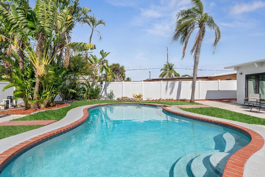 This charming 4 bedrooms, 3 bathrooms home in East Pompano offers the perfect combination of style and functionality.  This home comes with plug (220 outlet) for an electric vehicle, pest &  pool maintenance included.  New washer & dryer upon request!! This home features distinct living and dining areas, providing space for both family and privacy.  The kitchen is functional and ready for you personal touches.  The highlight of the property is the large backyard, featuring a sparkling pool and plenty of room for entertaining.  A brand-new privacy fence adds both security and seclusion.  Impact windows throughout provide enhanced safety and energy efficiency.  Located minutes from the beach, shopping, dining, and parks, this home offers both comfort and convenience!