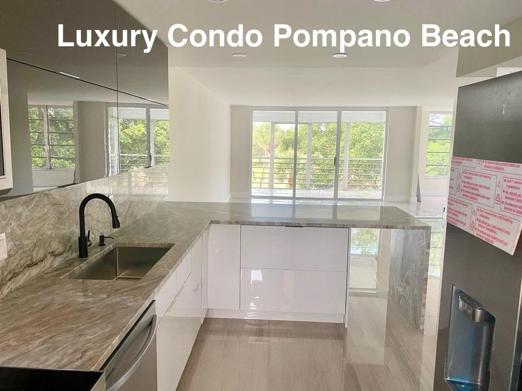Photo of 3960 Oaks Clubhouse Drive #401, Pompano Beach, FL 33069 (MLS # B26024158)