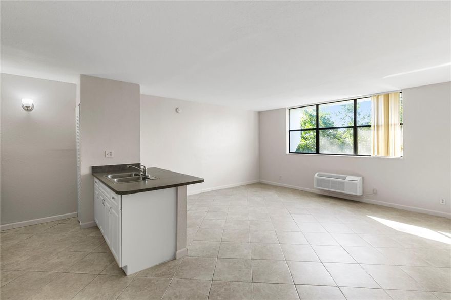 Top floor corner unit studio apartment/condo in the heart of Coral Springs. Freshly painted, Tile flooring, a walk-in closet, & NO popcorn on ceilings. Kitchen features a large counter-top & New Stove. New Roof on building. Close to major highways and roads, close to parks and shopping. Secured Building. Laundry facilities in the building. Pool. Great opportunity for investment. Unit can be rented right away. LOCATION & PRICE CAN'T BE BEAT! Don't miss out! Pets allowed.