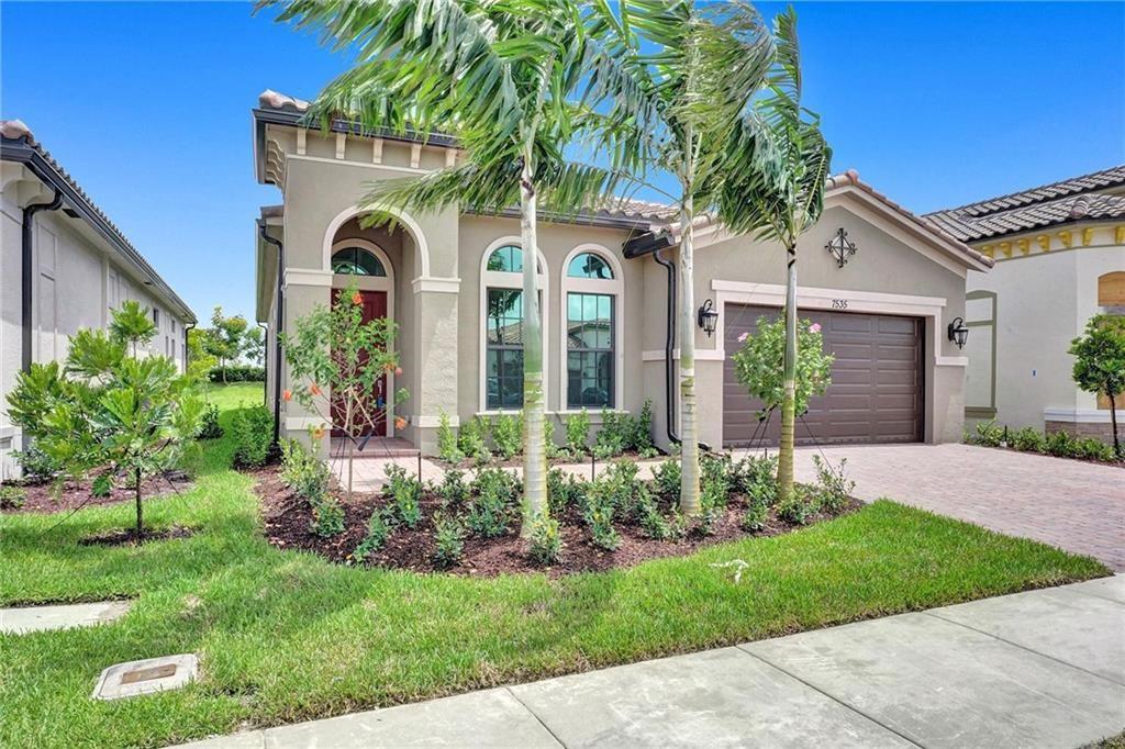 The Falls at Parkland! Stunning 2BR + Den (converted to 3rd BR) in a prestigious 55+ gated community with a 24,000 sqft clubhouse and resort-style amenities. This Spanish Elevation home features a gourmet kitchen with double-stacked white wood cabinetry, quartz countertops, oversized island with wood accent, 5-burner natural gas cooktop, French door fridge, and large walk-in pantry. Enjoy soaring 11'4" ceilings, impact windows/doors, crown molding, tray ceilings, tankless water heater, AC with Nest thermostat. The spacious owner's suite offers dual quartz vanities, oversized shower, and a large walk-in closet. Triple split floorplan creates a true great room setting, perfect for entertaining. Outdoor upgrades include newly installed screen enclosure,and new metal fence. Parkland’s finest