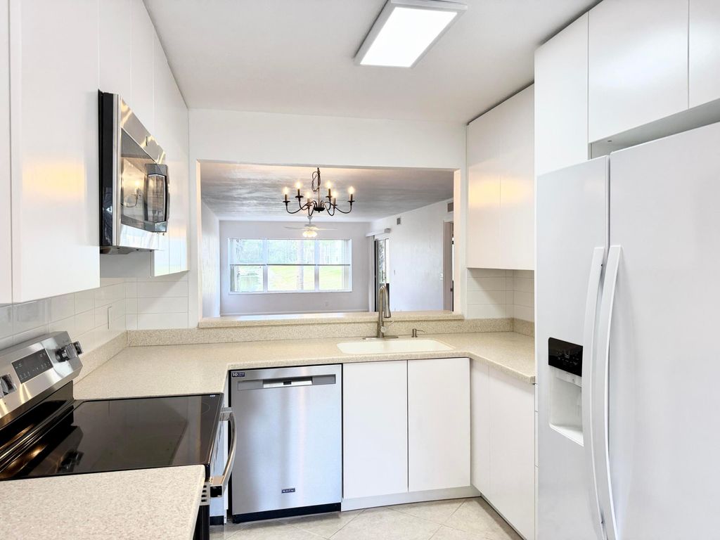 Photo of 4745 Lucerne Lakes Boulevard #102, Lake Worth, FL 33467 (MLS # R11157450)