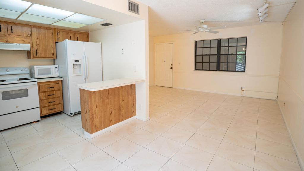 Photo of 4686 Oak Terrace Drive, Greenacres, FL 33463 (MLS # R11079116)