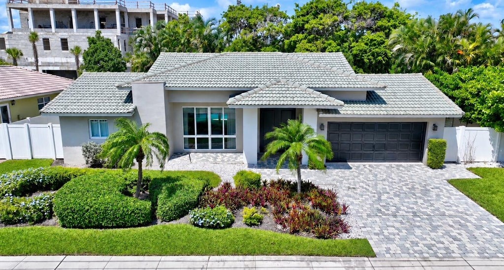 Photo of 3841 NE 6TH Drive, Boca Raton, FL 33431 (MLS # B26078393)
