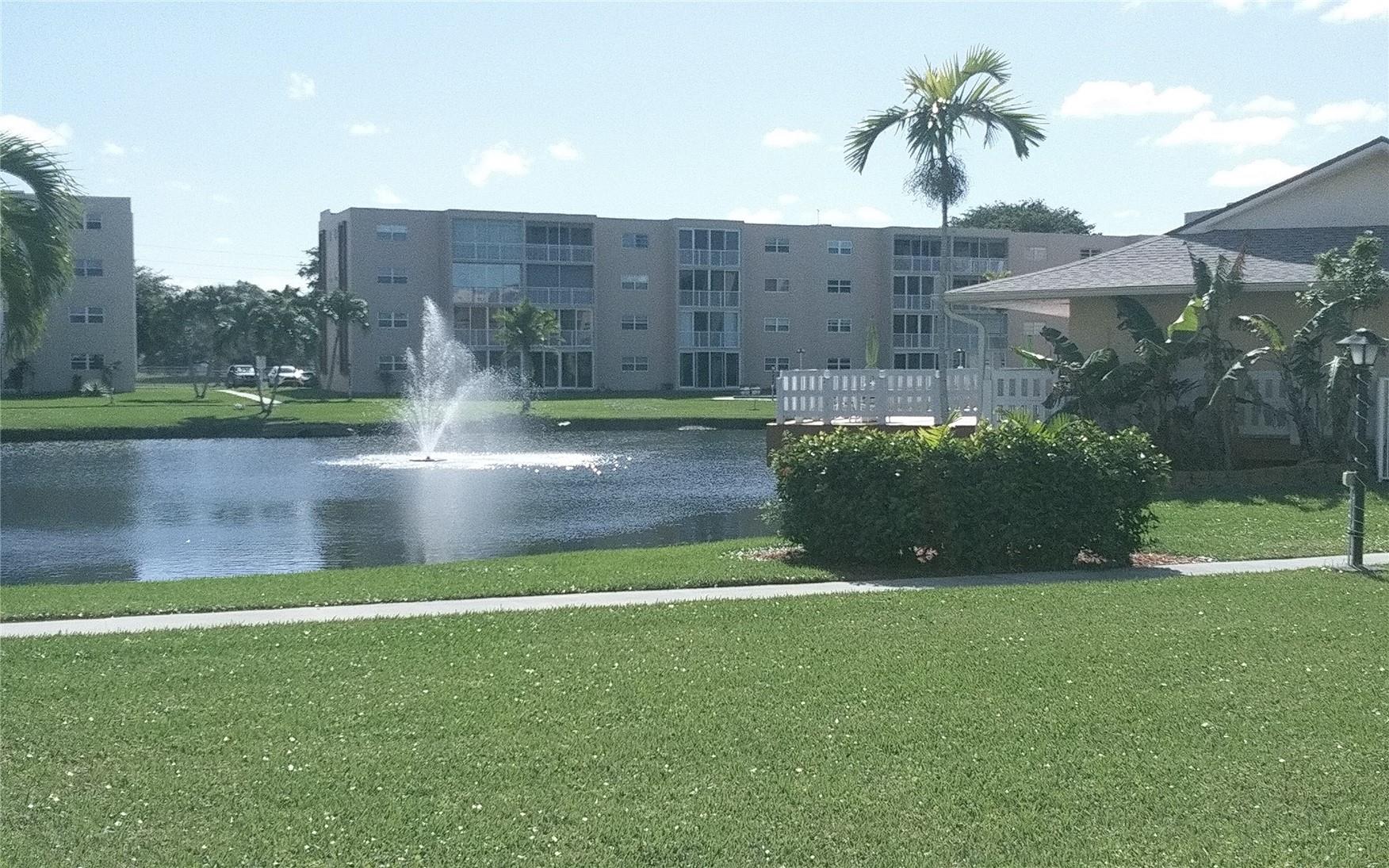 Great Deal! Just Reduced!!Spacious Top Floor 1Bedroom/1.5 Bath W/A Screened -In Balcony Overlooking A Beautiful Lake/Fountain View!..Upgraded Open Kitchen Featuring High Quality Craftmaid Real Oak Wood Cabinets, Under Cabinet Lighting & Granite Countertop!...Large Tile Throughout! New AC! Nicely Furnished! Newly Tiled Bathrooms W/Updated Vanities! 2 Large Walk-In Closets! Roll Down Hurricane Shutters! Low HOA! Peaceful 55+ Community On Well Kept Grounds...Amenities Include Heated Pool, Clubhouse, Shuffleboard, Bocce & BBQ Area! Close To Beaches, Shopping, Restaurants, Dania Pointe & More! No Renting 1st Yr(Renting Limited) Don't Miss This One!