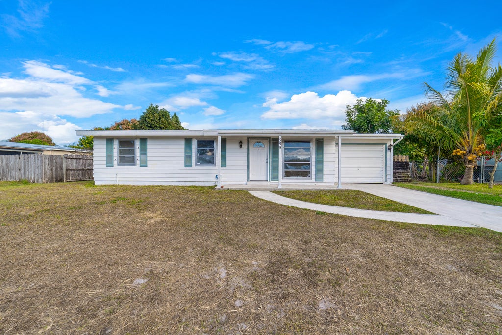Photo of 555 SE Airoso Boulevard, Port Saint Lucie, FL 34983 (MLS # R11152411)