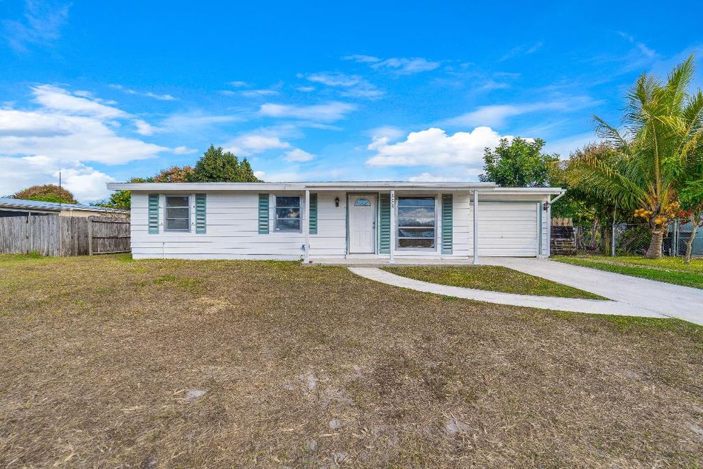 Photo of 555 SE Airoso Boulevard, Port Saint Lucie, FL 34983 (MLS # R11152411)