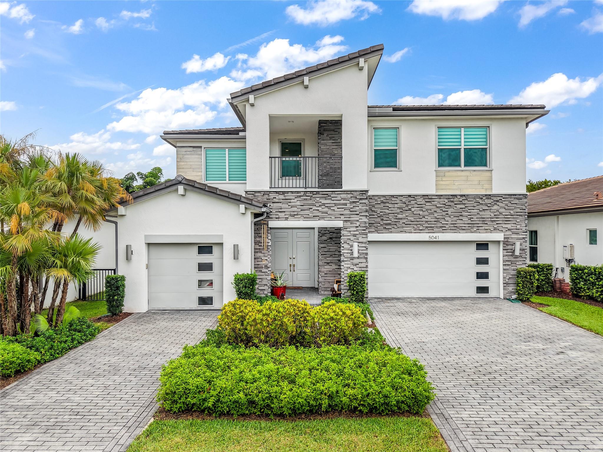 Fully renovated luxury home with high-end finishes throughout! Enjoy new flooring, crown molding, upgraded lighting, and a stunning remodeled master bath. The bright Florida room adds extra living space, while the new AC and washer/dryer provide comfort and convenience. Entertain or unwind by the private heated pool, surrounded by lush landscaping. The oversized 3-car garage includes a 240V EV charger hook-up, perfect for electric vehicles. Every detail has been thoughtfully updated—this move-in ready home offers the perfect blend of style, function, and comfort. A rare find—schedule your private showing today!