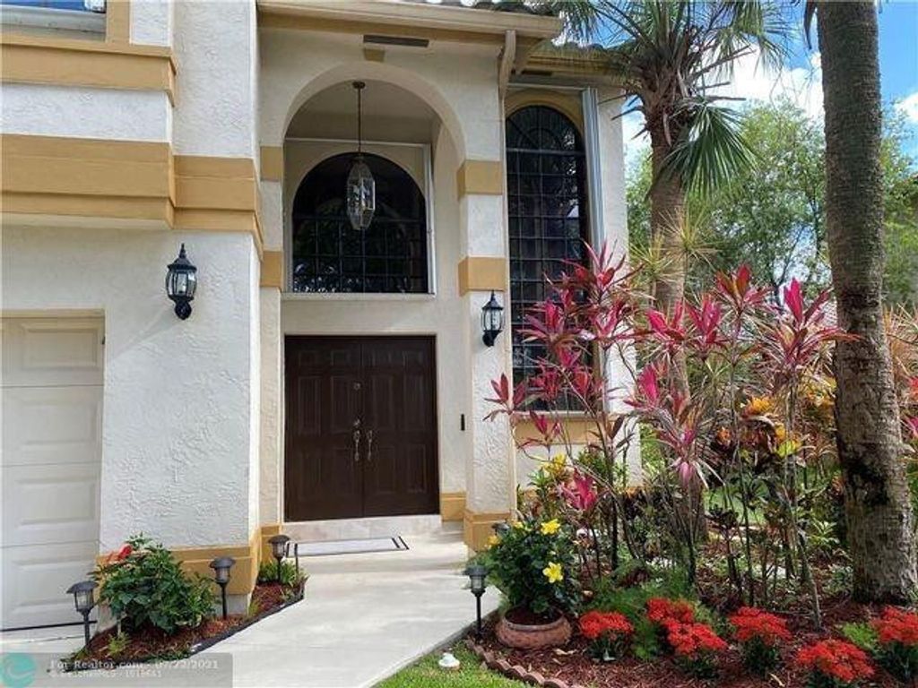 Photo of 5721 NW 63rd Place, Parkland, FL 33067 (MLS # F10430605)